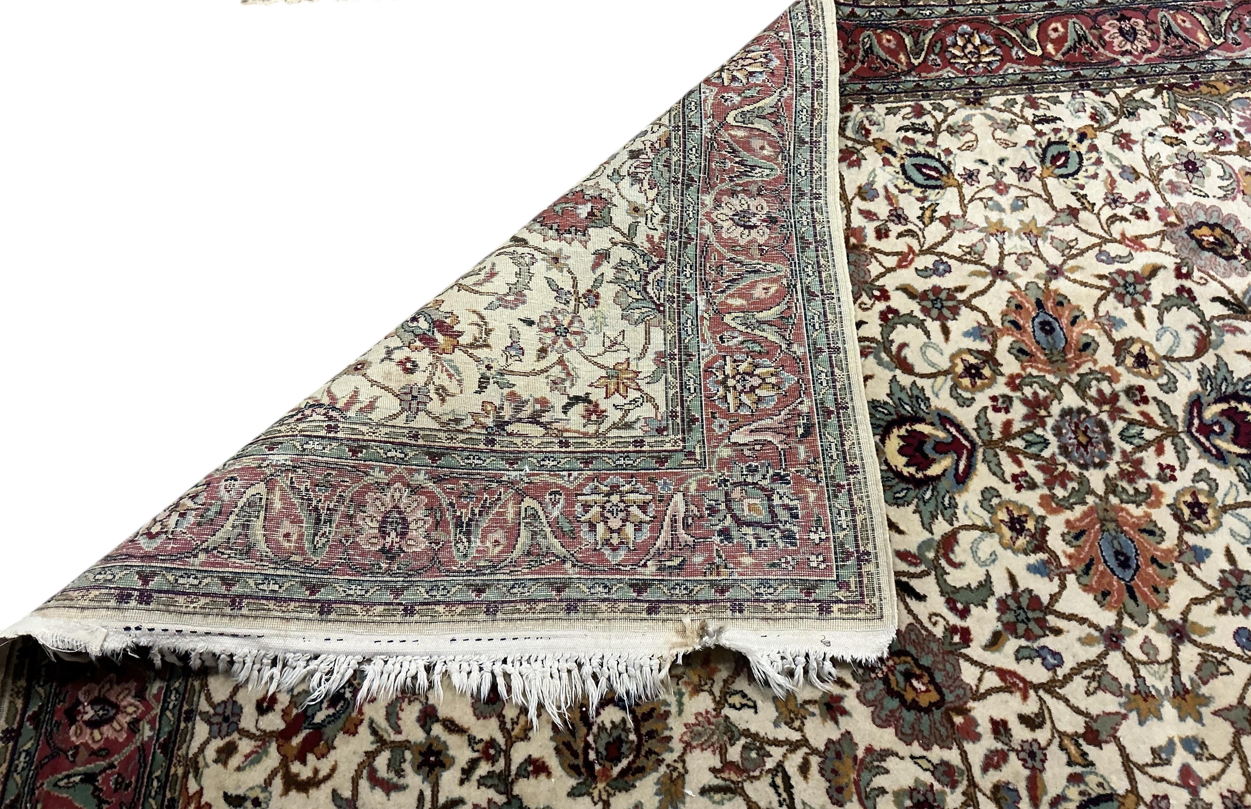A Tabriz ivory ground carpet, 230 x 146cm